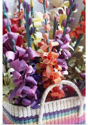 Close-up of a flower arrangement in a basket.