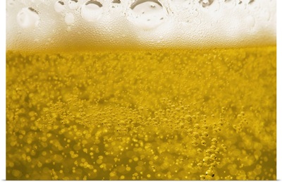 close-up of beer bubbles and foam in a glass