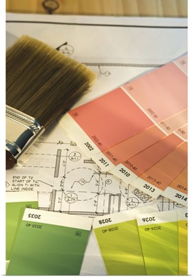 Close up of blueprint and painting supplies
