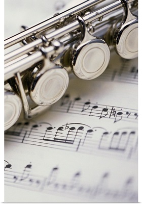 Close up of flute on sheet music