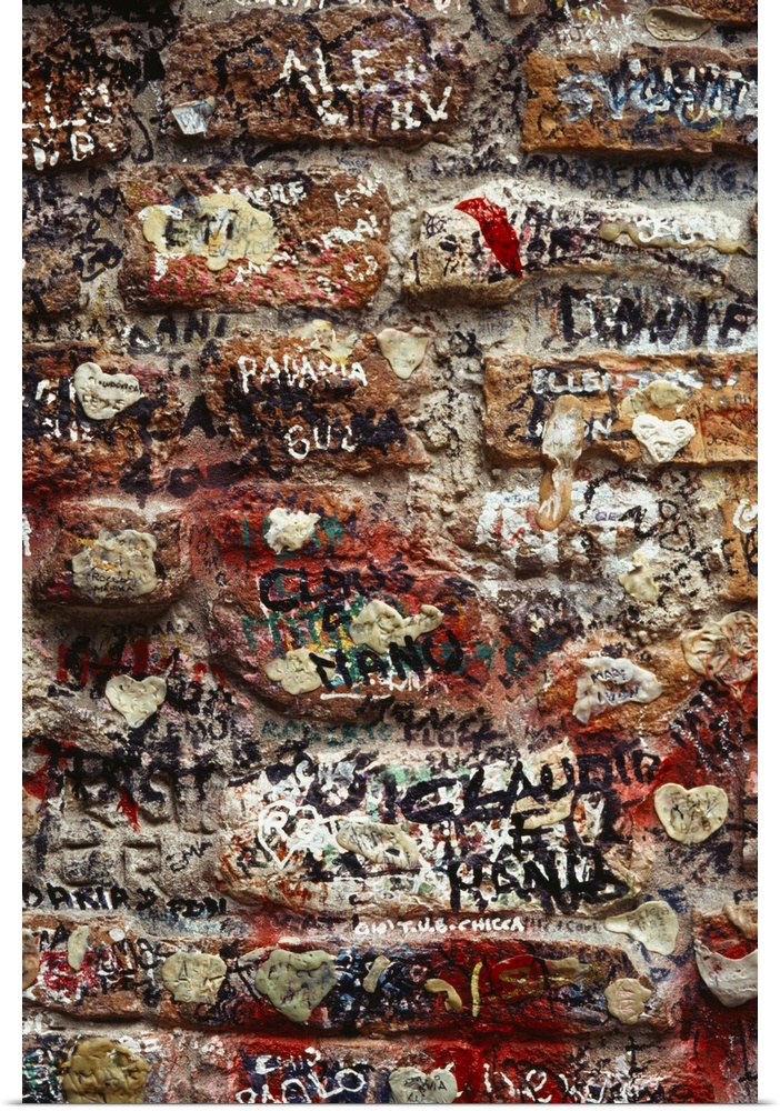 Close-up of graffiti on a brick wall in Verona, Italy
