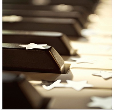 Close up of piano keys with stars.
