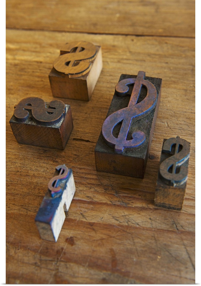 Close up of printing blocks with dollar sign on wood