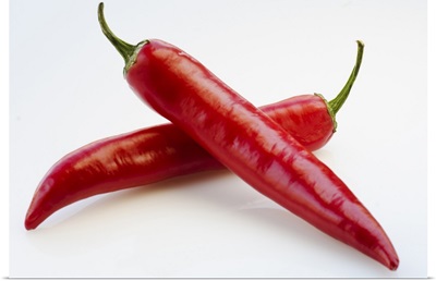 Close up of red chili peppers on white background