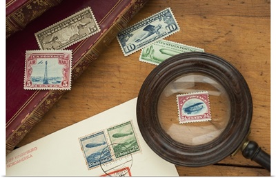 Close up of stamps collection and magnifying glass