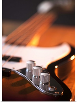 Close up of volume knobs of bass guitar