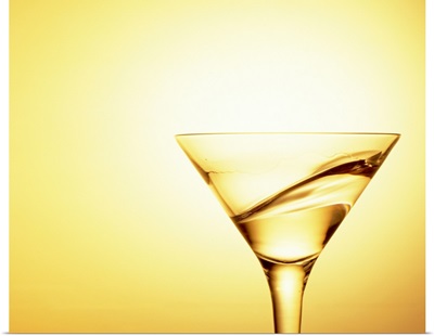 Cocktail swirling in a martini glass