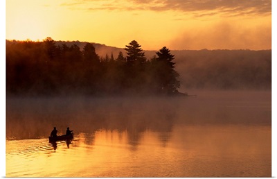 Couple canoeing in early morning