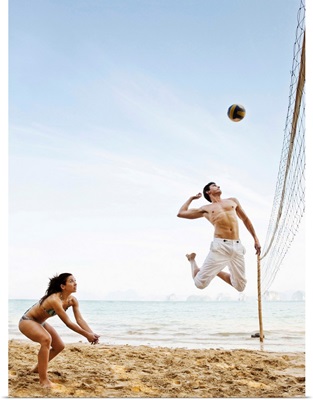 Couple Playing Beach Volleyball at Six Senses Hideaway Yao Noi, Koh Yao Noi, Thailand.