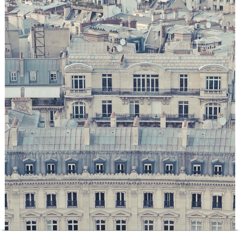 Cream colored apartments with grey blue roofs in Paris, France.