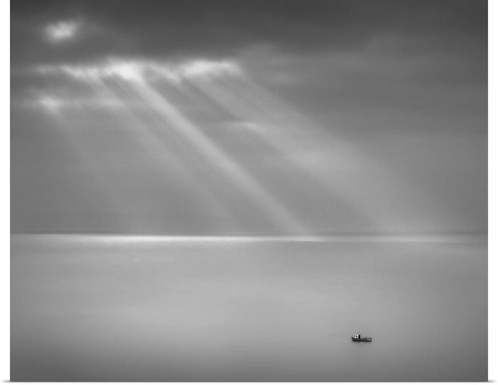 Crespecular rays over lone fishing boat in Bristol Channel off Brean Down, England, UK.