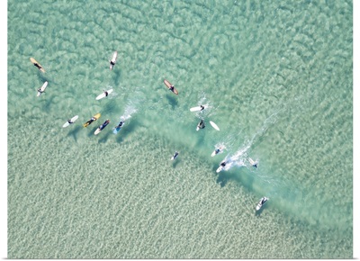 Crystal Clear Waters With Surfers Seen From Above
