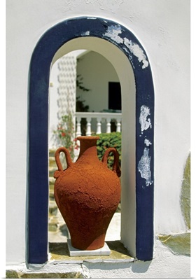 Decorative vase placed on an arched window of a house, Santorini, Greece