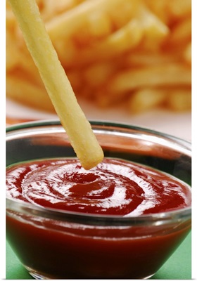 Dipping french fries in ketchup