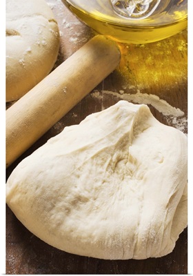 Dough, rolling pin and olive oil