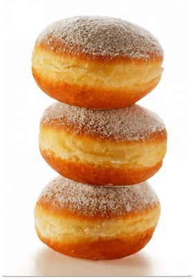 Doughnuts with icing sugar, in a pile
