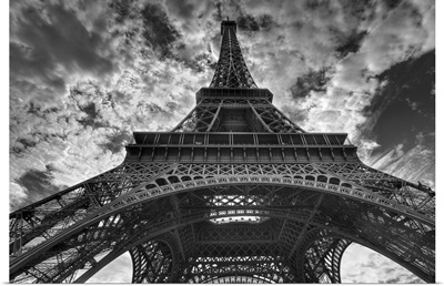 Eiffel tower and cloudy sky in Paris.