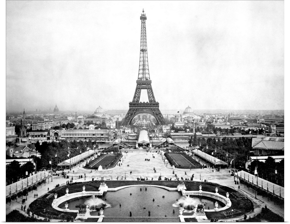 The Eiffel Tower stands overlooking the promenades and fair grounds of the Paris Exposition, 1889 and the city's center. F...