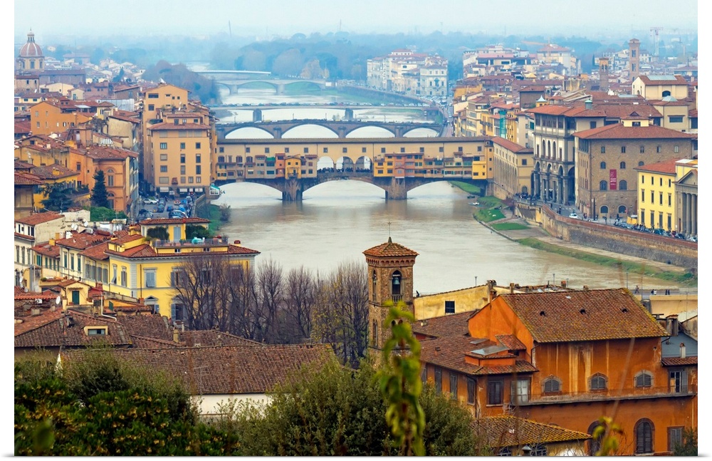 Giant photograph overlooking the Fiume Arno surrounded by a busy city within Italy.  On the shores of the river, the build...