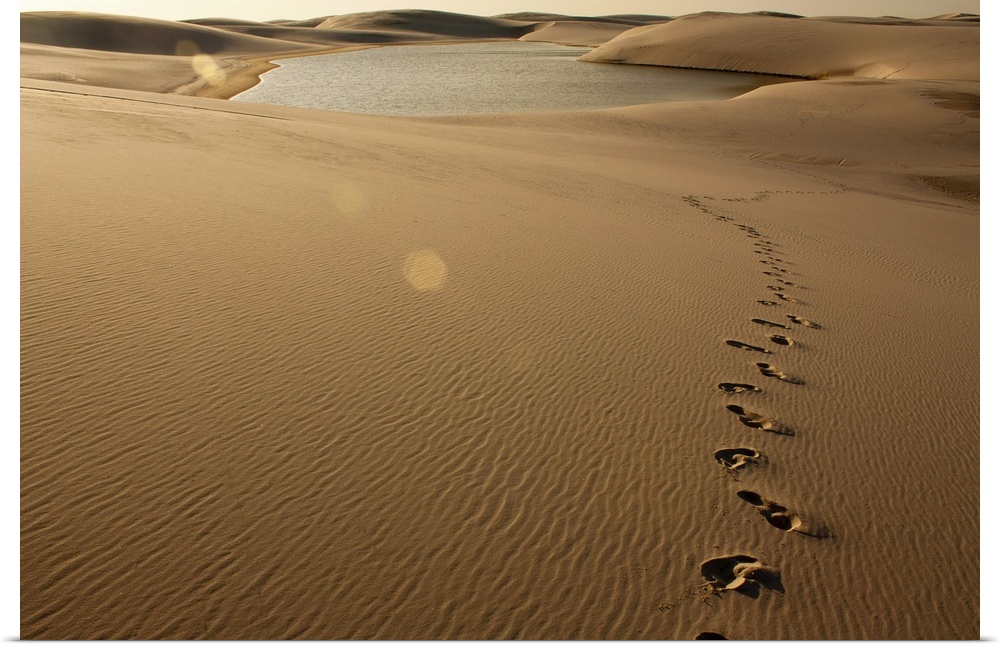 Footprint on sand dune at Lenois Maranhenses in Barreirinhas, Brazil.