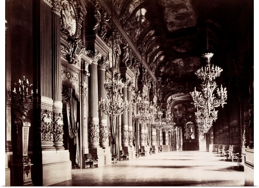 Foyer of the Opera in Paris, France. The hall is lined with engaged columns with corinthian capitals. The vaulted ceiling ...