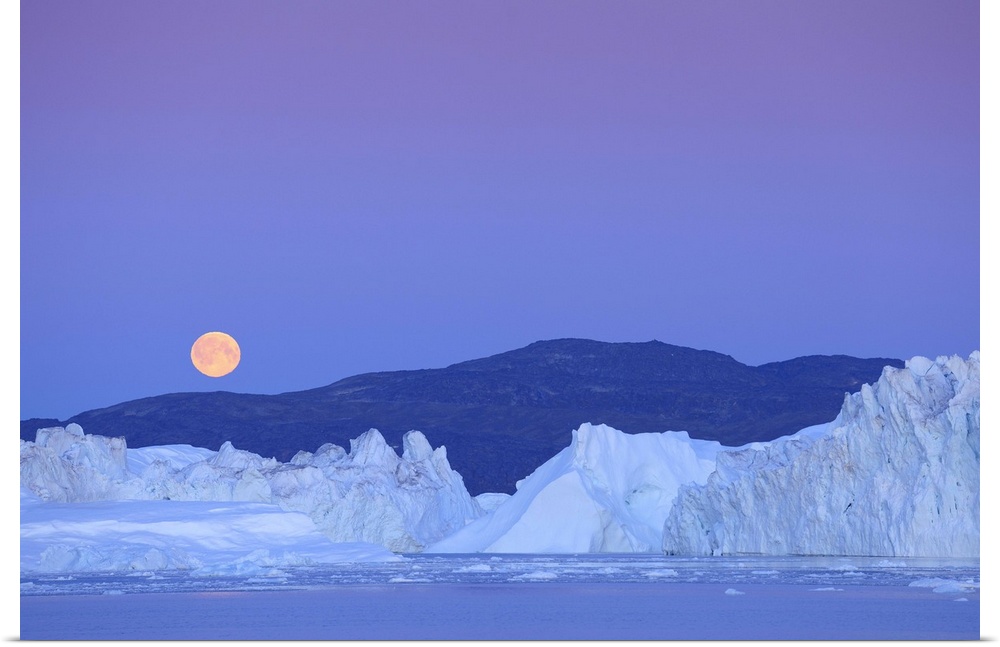 Full moon over iceberg, Ilulissat, Icefjord, Greenland,