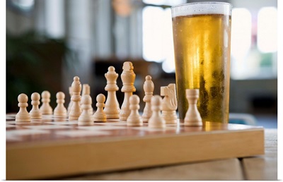 Glass of beer on chess board