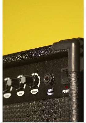 Guitar amplifier on yellow background