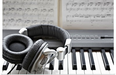 Headphones on electronic piano keyboard