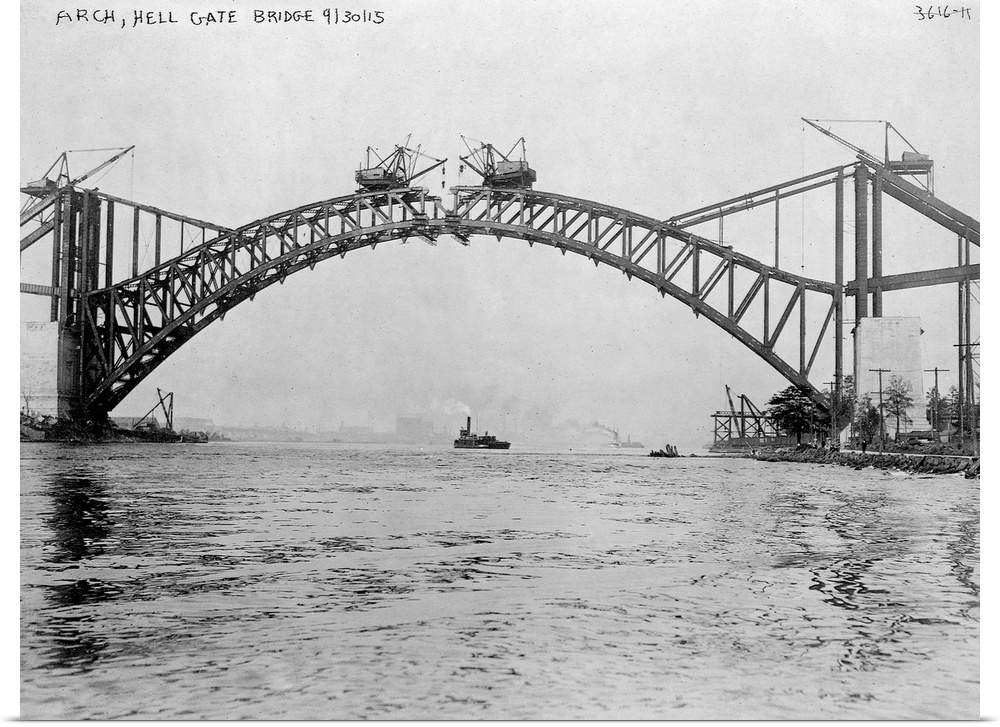 Cranes manuever to place steel beams during the contruction of the Hell Gate Bridge over the East River. When completed th...