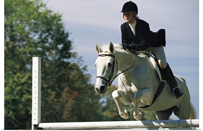 Horse jumping in equestrian event