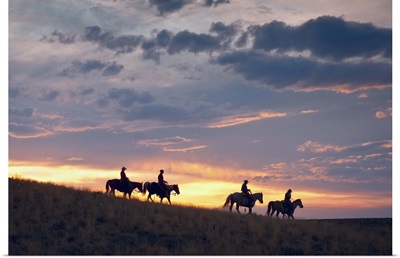 Horseback Riders At Sunset