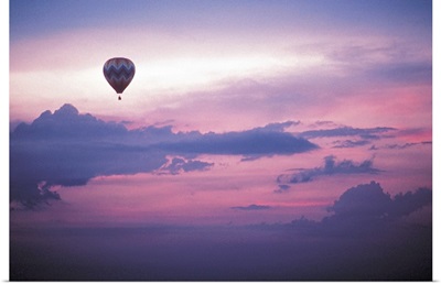 Hot air balloon in sky at dawn