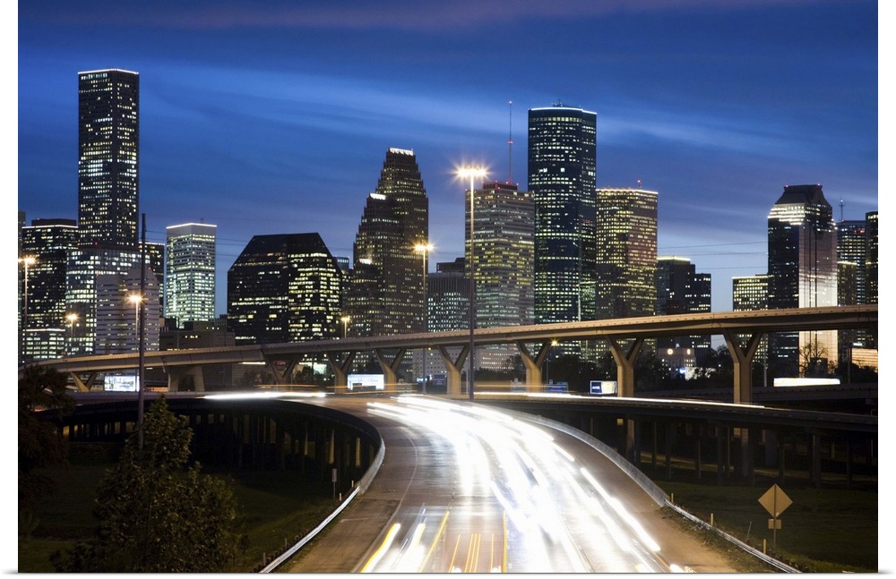 Houston skyline at dusk with freeway in foreground