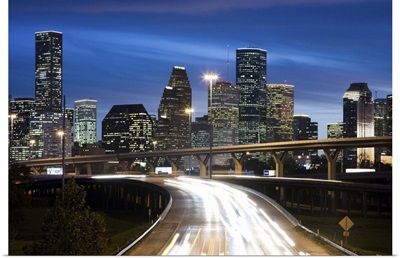 Houston skyline at dusk with freeway in foreground, Texas