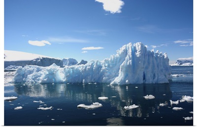 Iceberg Against Dark Blue Waters And Sky