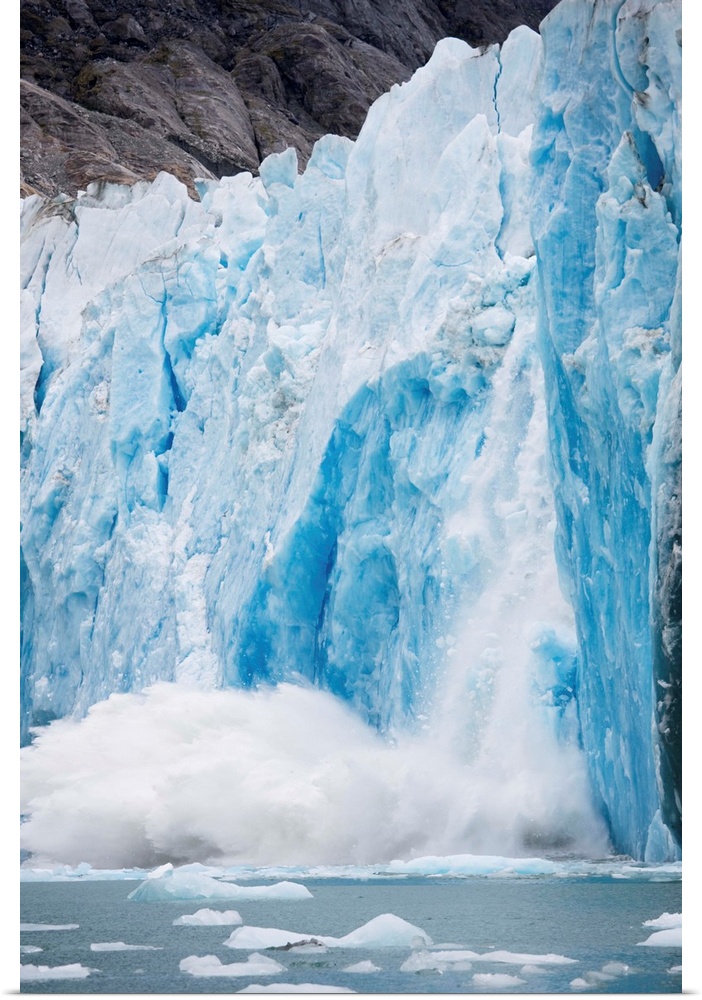 Icebergs calving from face of Dawes Glacier along Endicott Arm.