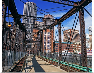 Iron footbridge with Boston Financial district in background