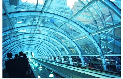 Japan, Tokyo, Passengers on escalator at station