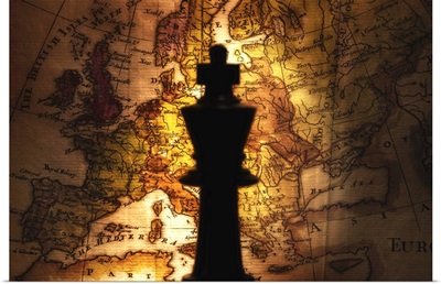 King chess piece on old world map