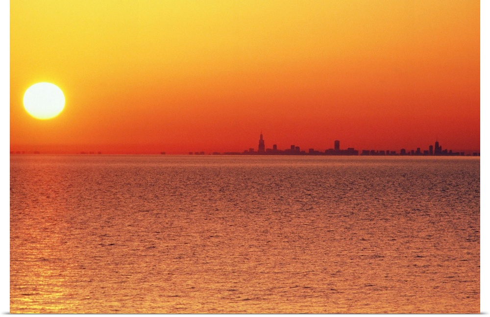 USA,Chicago,Lake Michigan,orange sunset,city skyline in distance