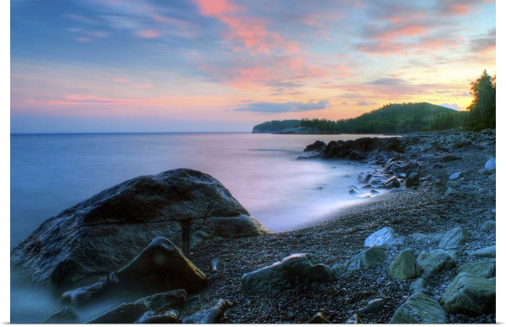 Beautiful summer sunset along rocky shore of Lake Superior.