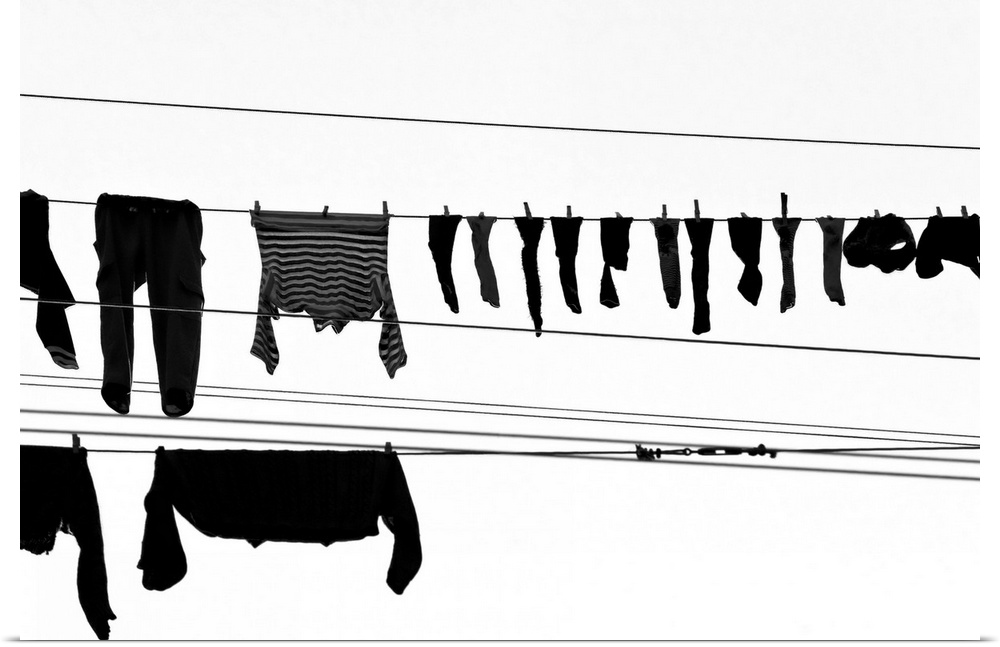 Laundry drying on a wo clothesline, with a lot of socks and underwear in the foreground, Genoa, Liguria, Italy.