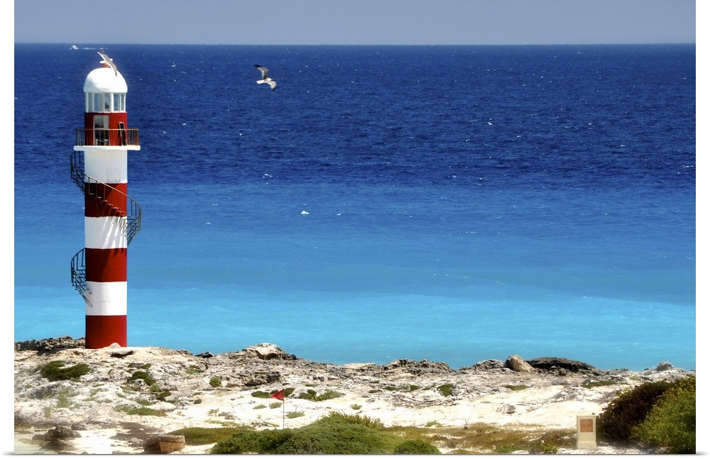 Lighthouse against beach in Cancun, Mexico.
