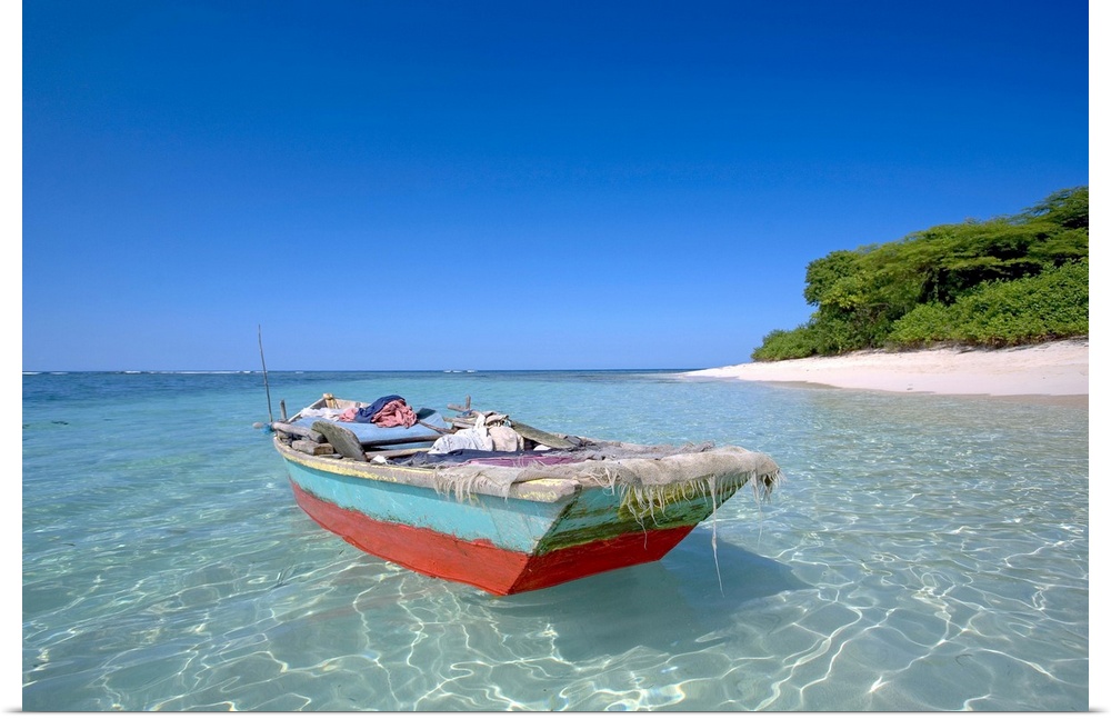 Haiti, Nord, local boat at Isla Amiga. Isla Amiga was named and marked by Christopher Columbus on his first voyage to the ...