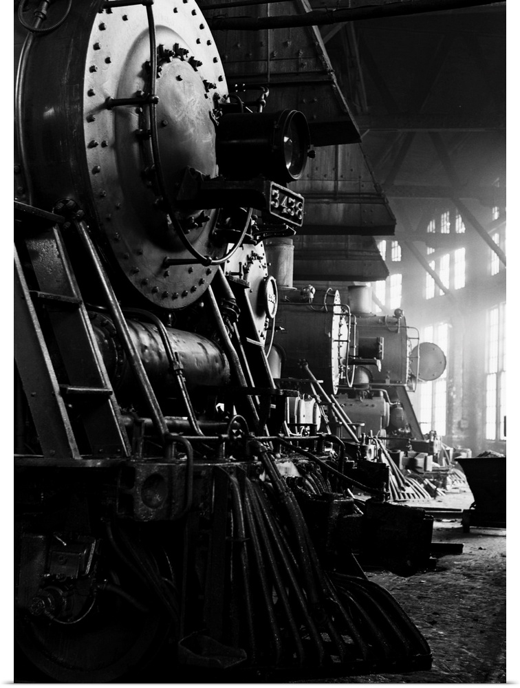 Locomotives in the Atchison, Topeka and Santa Fe Railway roundhouse in Shopton, near Fort Madison, Iowa. Note train contro...