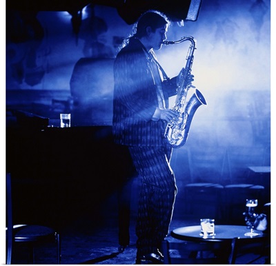 Lone saxophonist performing in club