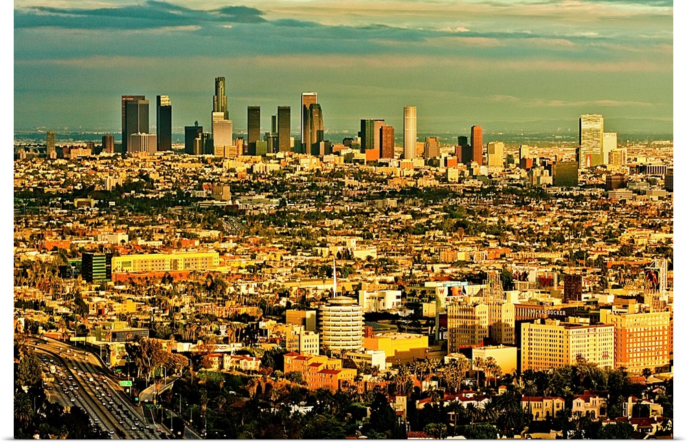 Los Angeles from above with Hollywood in foreground and LA skyline in distance.