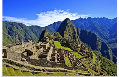 Machu Picchu is a 15th century Inca site on a mountain ridge above the Urubamba Valley