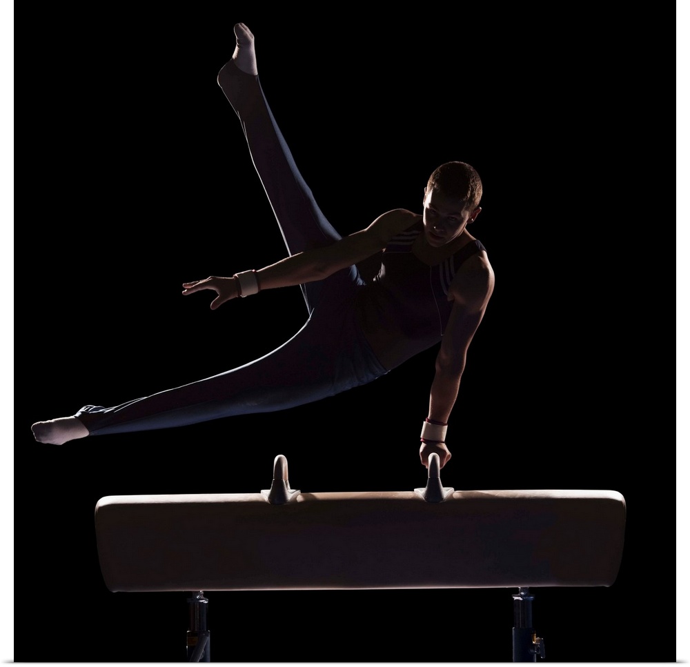 Male gymnast on pommel horse